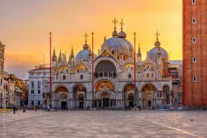 View of Basilica di San Marco and on piazza San Marco in Venice, Italy. Architecture and landmark of Venice. Sunrise cityscape of Venice.