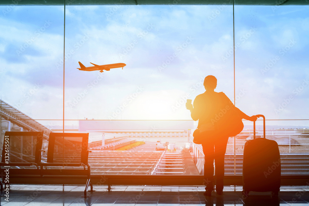happy traveler waiting for the flight in airport, departure terminal, immigration concept